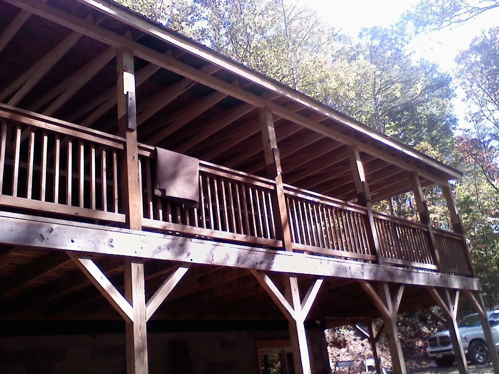 Timber framing under a new elevated porch and deck — Roof Leak Repair in Pewamo by Roofing Brothers